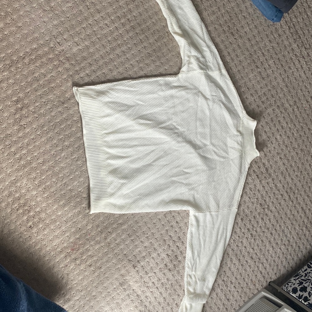 White medium sized turtle neck sweater.